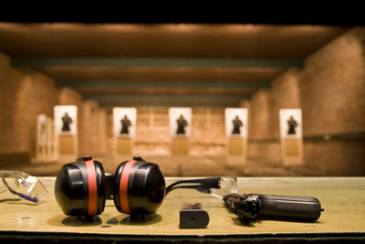 A demonstration of safety equipment at the shooting range.